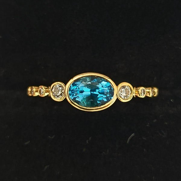 14K Gold Fashion Ring with Blue Topaz Center