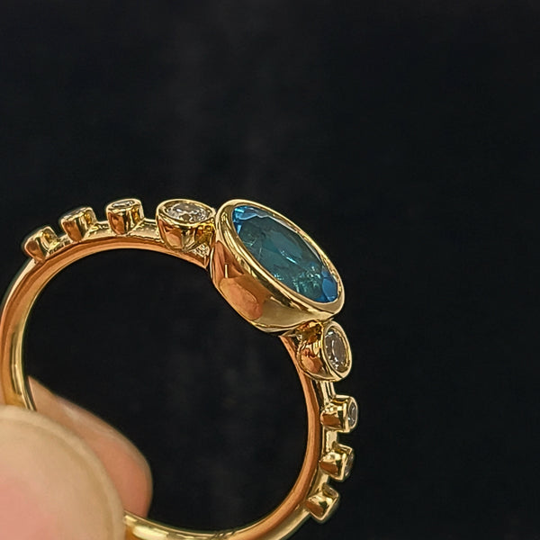 14K Gold Fashion Ring with Blue Topaz Center